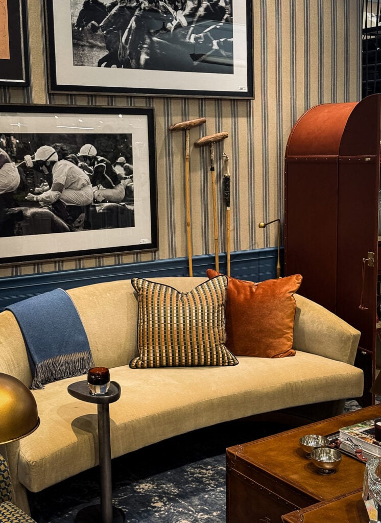 Sofa, artwork and furnishings inside Yates Desygn’s A Private Affair vignette at Dallas Market Center